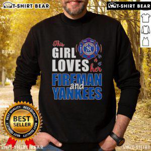 Alt Text: Premium sweatshirt featuring 'This Girl Loves Her Fireman and Yankees', perfect for fans of firemen and baseball.