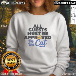 Cozy 'Top All Guests Must Be Approved By The Cat' sweatshirt featuring playful cat graphics, perfect for cat lovers.