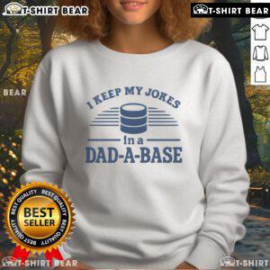 Man wearing a 'Top I Keep My Jokes In A Dad A Base' sweatshirt, showcasing humor and style in casual fashion.