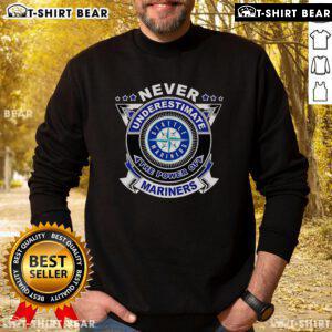 Alt Text: Cozy mariners sweatshirt with Never Underestimate the Power of Mariners slogan, perfect for fans and casual wear.
