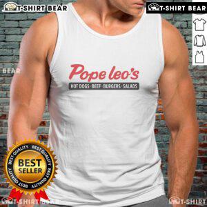 Delicious spread of Pope Leo's hot dogs, beef burgers, and fresh salads served at a tank top-themed event.