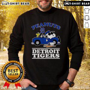 Top Snoopy and Woodstock Peanuts Detroit Tigers sweatshirt featuring classic cartoon characters and team logo.