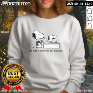 Cozy Snoopy sweatshirt featuring 'The Work Is Mysterious and Important' design, perfect for fans of Peanuts and comfy fashion.