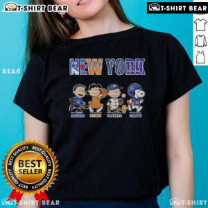 Alt Text: Cute Peanuts graphic tee featuring New York Rangers, Knicks, Yankees, and Giants for ladies. Perfect for sports fans!