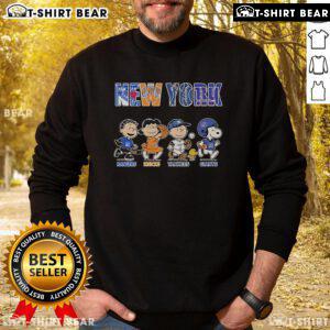 Alt Text: Cute Peanuts sweatshirt featuring New York Rangers, Knicks, Yankees, and Giants logos, perfect for sports fans.