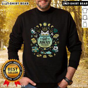 Alt Text: Funny witch cat at work on a sweatshirt, saying Go away, I'm busy, perfect for cat lovers and Halloween enthusiasts.