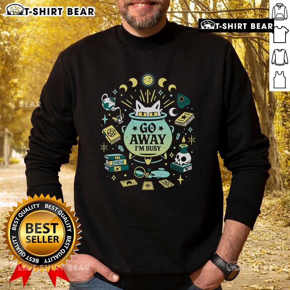 Alt Text: Funny witch cat at work on a sweatshirt, saying Go away, I'm busy, perfect for cat lovers and Halloween enthusiasts.