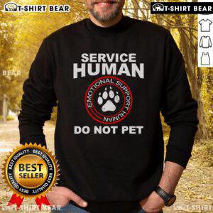 Emotional support human wearing a sweatshirt with 'Good Service Dog Owner' text, showcasing a loving bond with their dog.
