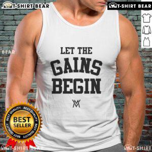 Alt Text: Calum Von Moger wearing 'Let The Gains Begin' tank top, showcasing fitness style and motivation for gym enthusiasts.