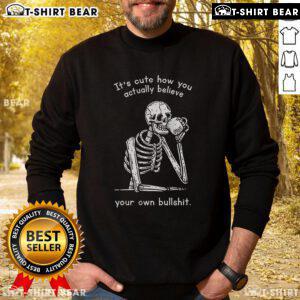 Official 'It's Cute How You Actually Believe Your Own Bullshit' Skeleton Sweatshirt in black with bold graphic design.