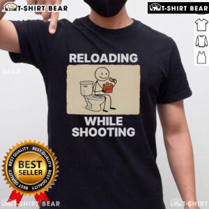 Funny 'Reloading While Shooting' toilet humor t-shirt design featuring playful graphics and bold text for gun enthusiasts.