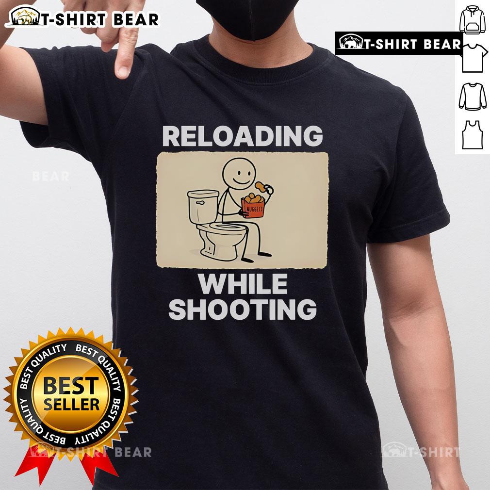 Funny 'Reloading While Shooting' toilet humor t-shirt design featuring playful graphics and bold text for gun enthusiasts.