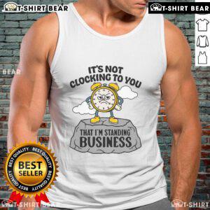 Alt Text: Woman wearing a 'Premium It's Not Clocking To You' business tank top, showcasing stylish and bold fashion statement.