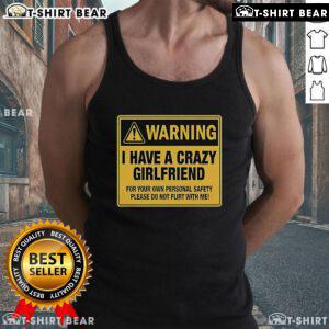 Premium warning tank top stating 'I have a crazy girlfriend, please do not flirt with me' for a fun, bold style.