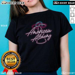 Pretty American Alchemy UFO neon logo on a stylish ladies tee, perfect for UFO enthusiasts and fashion lovers.
