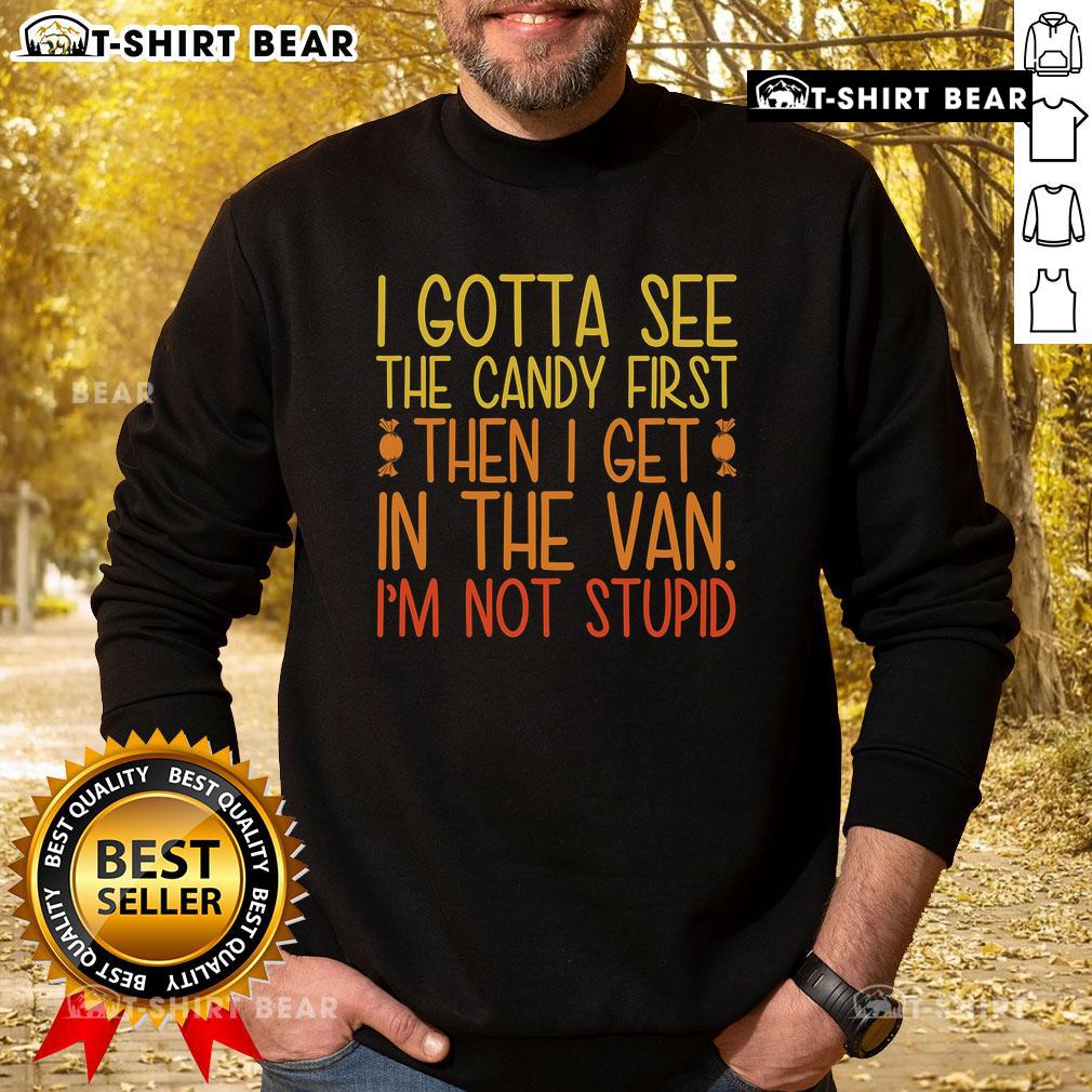 Child in a colorful 'Pretty I Gotta See The Candy First Then I Get In The Van' sweatshirt, smiling with excitement.