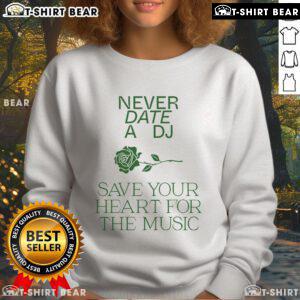 Alt Text: Cozy 'Pretty Never Date A DJ Save Your Heart For The Music' sweatshirt, perfect for music lovers and stylish comfort.
