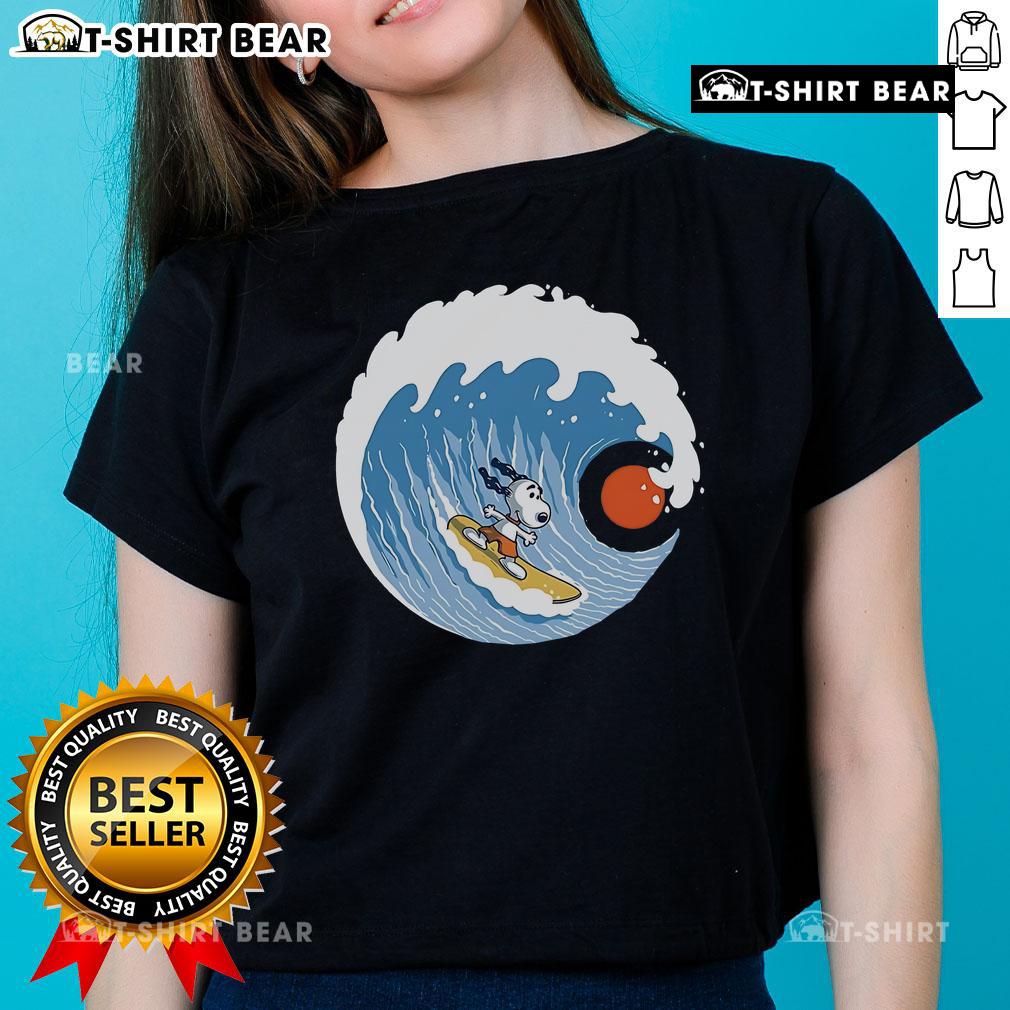 Pretty Snoopy Big Wave Adventure ladies tee featuring a colorful design of Snoopy surfing on a big wave.