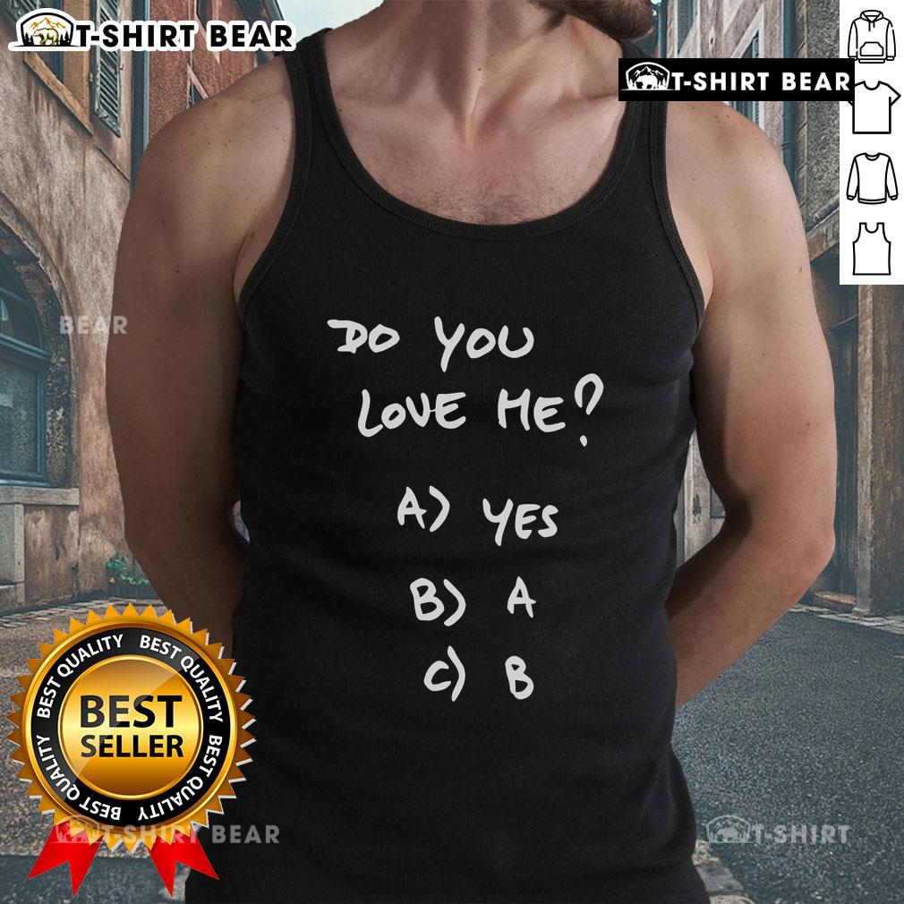 Alt Text: Top Franco Mastantuono wearing a 'Do You Love Me' tank top, showcasing casual street style and vibrant fashion.