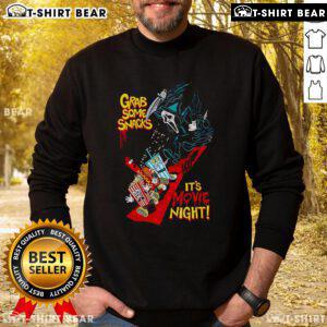 Cozy 'Top Grab Some Snacks It's Movie Night' sweatshirt featuring fun typography, perfect for comfortable movie nights.