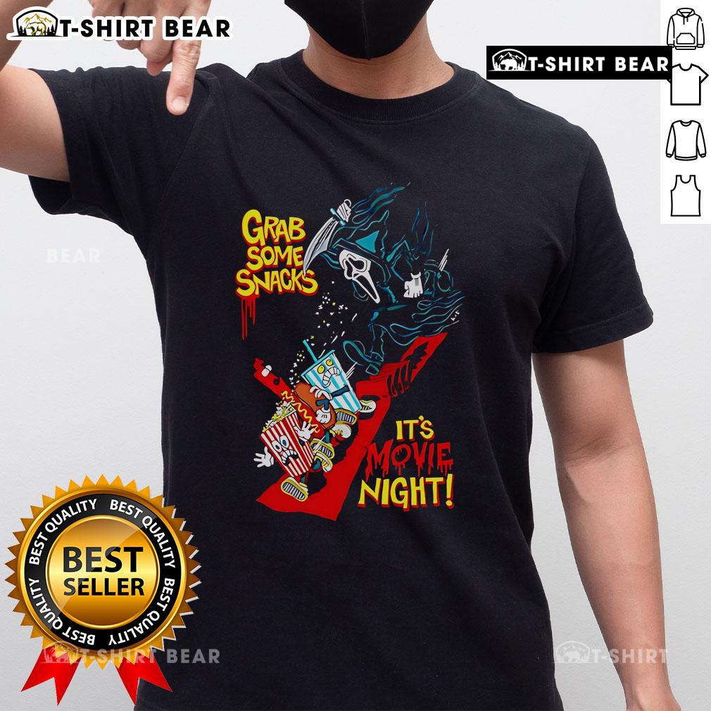Alt Text: Top Grab Some Snacks It's Movie Night T-Shirt featuring fun design and vibrant colors for movie lovers.