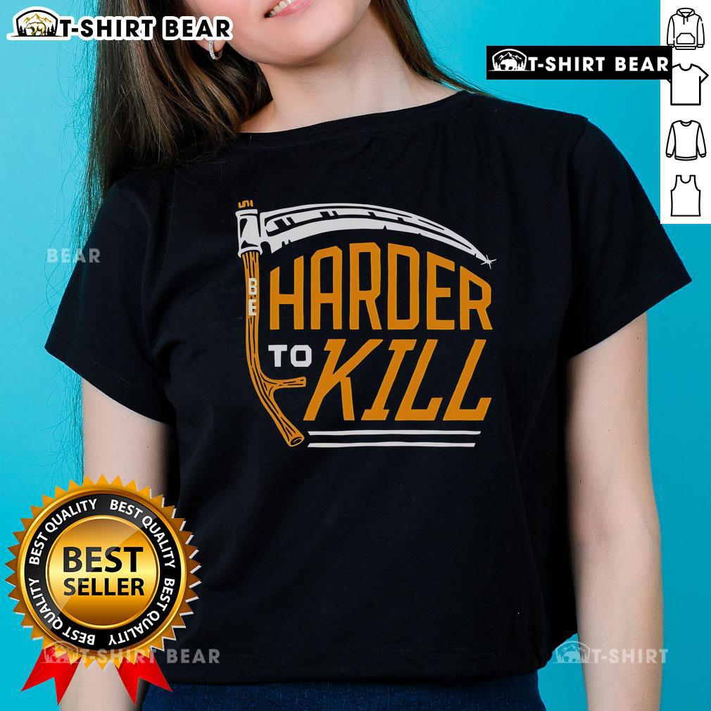 Top-Harder-To-Kill-Ladies-Tee featuring a bold graphic design, perfect for strong women who embrace empowerment and style.