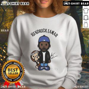 Top Kendrick Lamar wearing a colorful monkey chibi sweatshirt, showcasing a unique streetwear style.