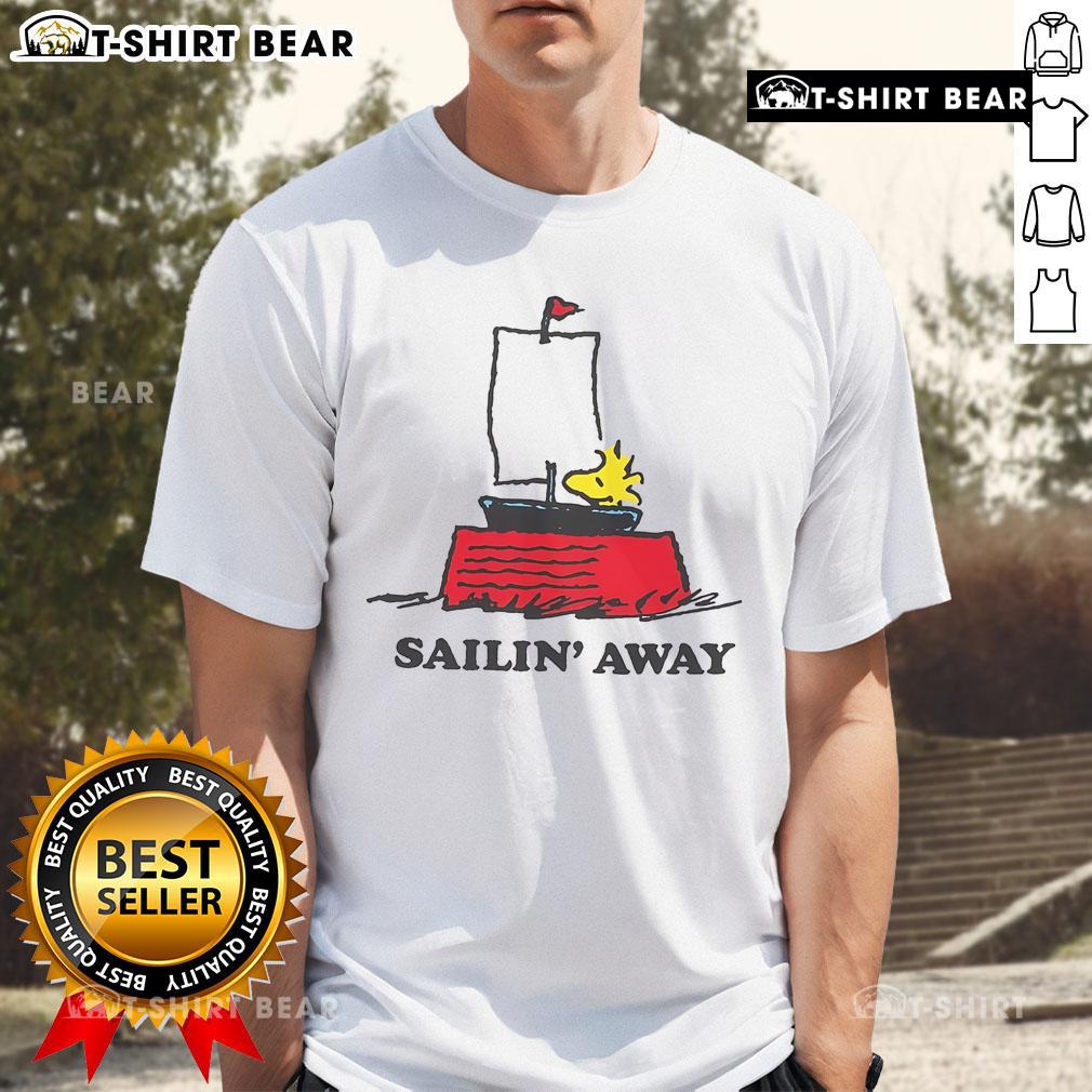 Alt Text: Top Peanuts Sailin Away T-Shirt featuring Snoopy and friends on a colorful sailing adventure design.