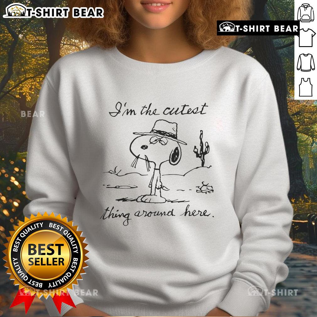 Top Snoopy I'm The Cutest Thing Around Here sweatshirt featuring a playful Snoopy graphic on a cozy background.