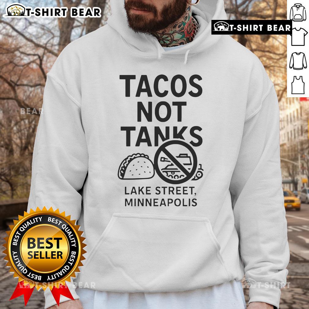 Alt Text: Top Tacos Not Tanks hoodie showcased in Minneapolis, emphasizing local culture and vibrant street style.