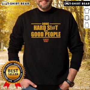 Top Washington Commanders sweatshirt featuring 'Doing Hard Shit With Good People' design, perfect for fans and casual wear.