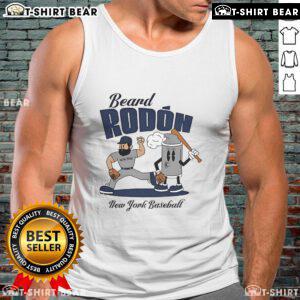 Alt Text: Carlos Rodon in a New York Yankees tank top, showcasing his beard during mid-summer baseball season.