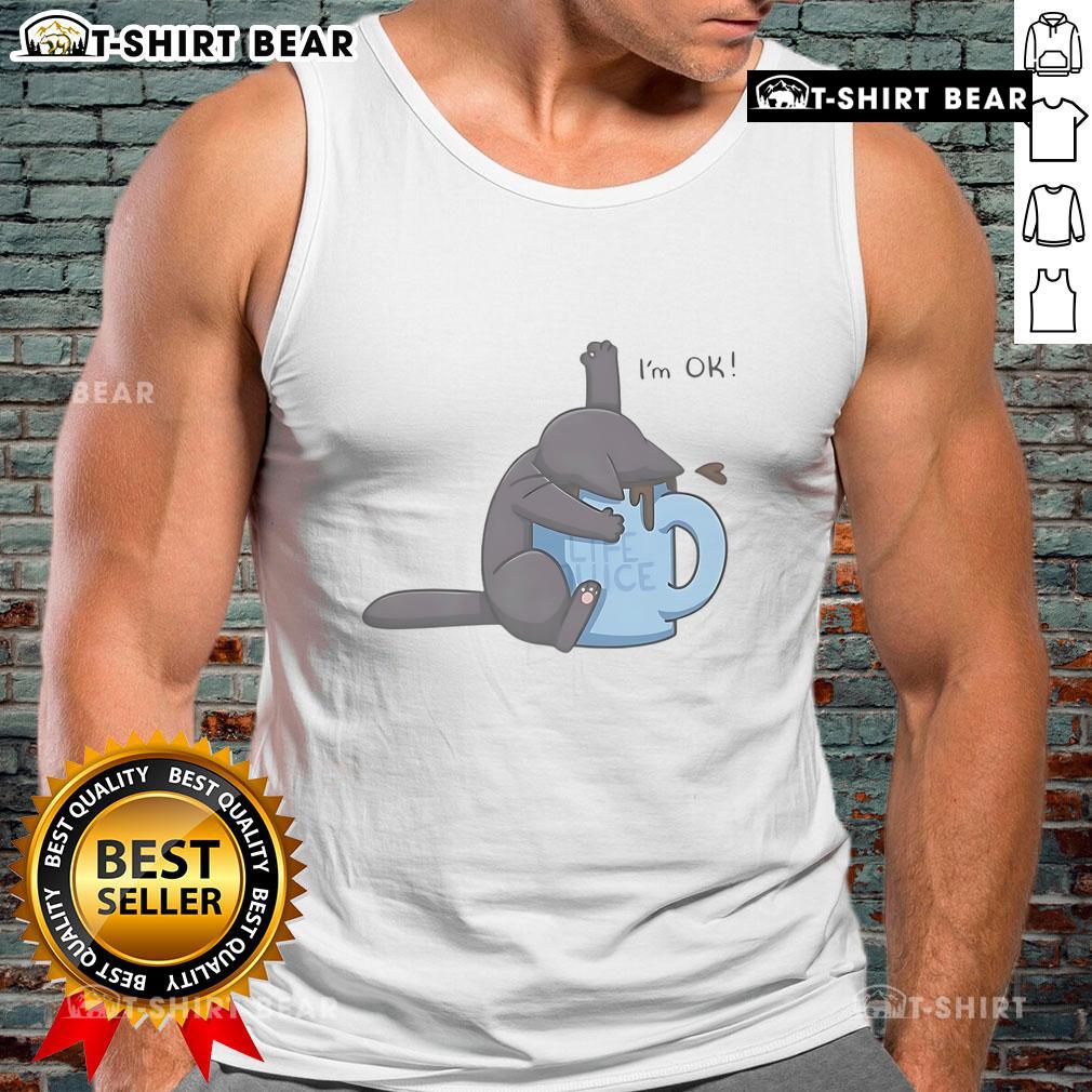Cute cat playfully submerged in a coffee cup, wearing an 'I'm OK' tank top, perfect for coffee lovers and cat enthusiasts.