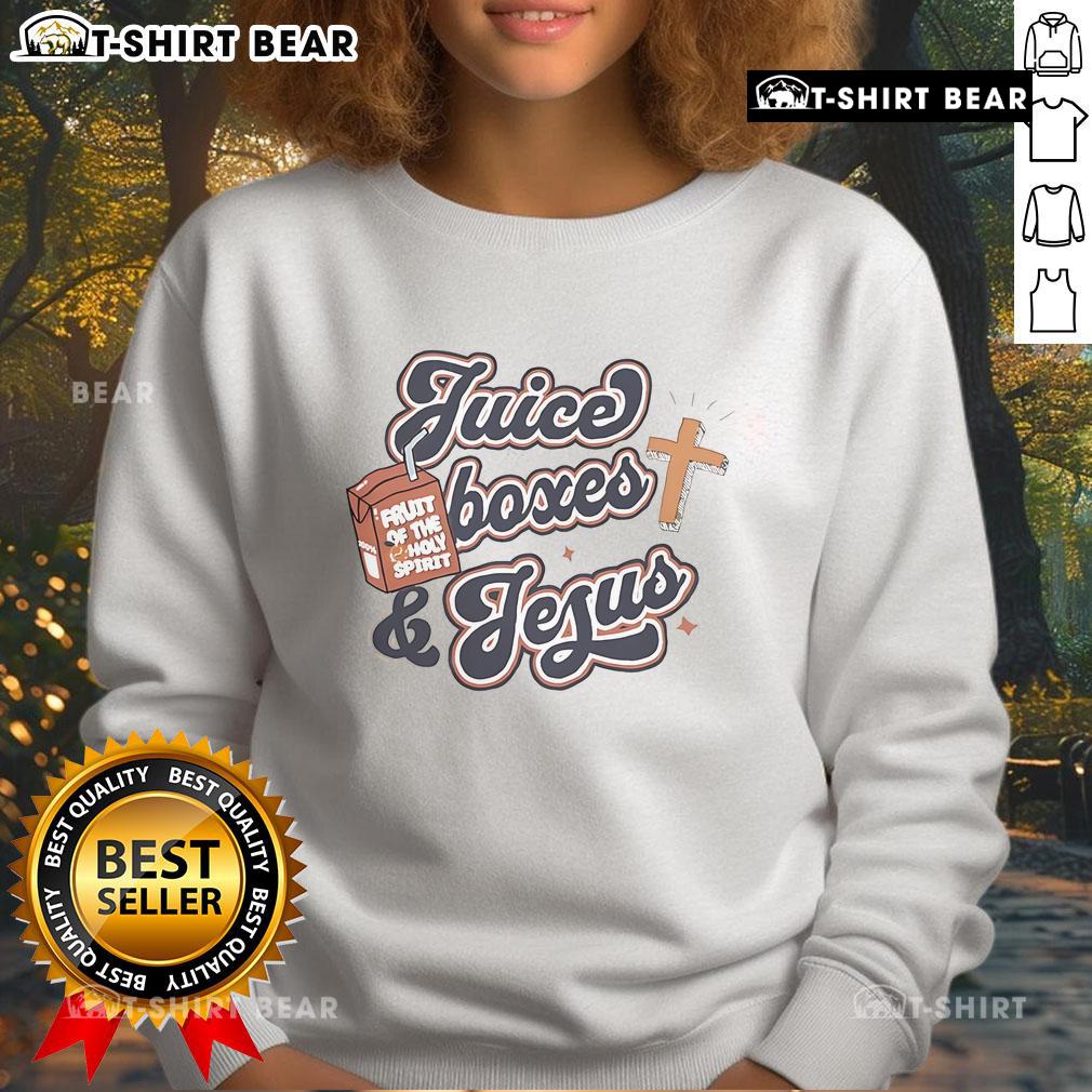 Colorful juice boxes beside a cozy Jesus sweatshirt, perfect for casual outings and faith-inspired fashion.
