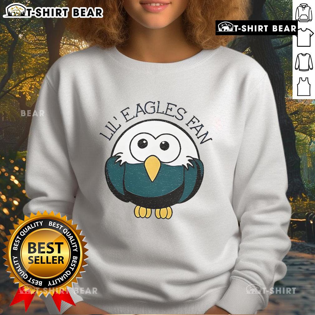 Adorable Lil Eagles fan in an official Philadelphia Eagles NFL football sweatshirt, showing team spirit and style.