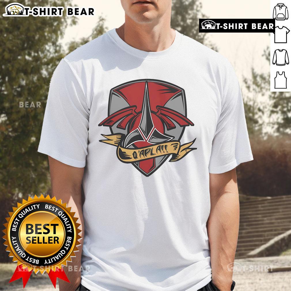 Alt Text: Official Q'Apla tattoo t-shirt featuring a striking design, perfect for fans of body art and stylish apparel.