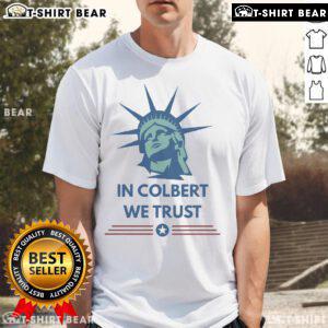 Official Stephen Colbert In Colbert We Trust T-Shirt featuring bold text design, ideal for fans of the late-night host.