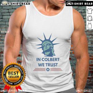 Official Stephen Colbert In Colbert We Trust tank top featuring bold text design and vibrant colors for fans.
