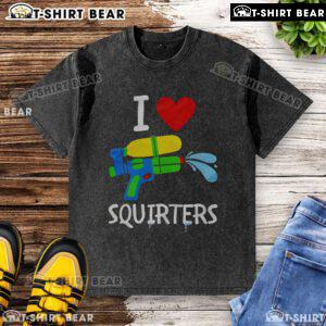 Original I Love Squirters washed t-shirt displayed on a wooden background, showcasing its unique design and soft fabric.