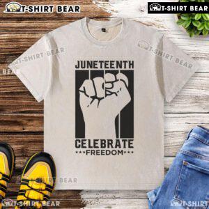 Premium Juneteenth Celebrate Freedom Fist Washed T-Shirt featuring a bold fist graphic, perfect for celebrating freedom.