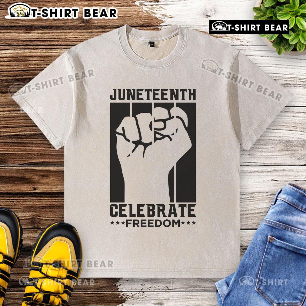 Premium Juneteenth Celebrate Freedom Fist Washed T-Shirt featuring a bold fist graphic, perfect for celebrating freedom.