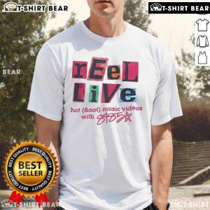 Pretty Reel live performance featuring Hot Not music videos and a stylish 8485 T-shirt on stage.