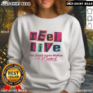 Kimmie wearing a stylish sweatshirt during the Pretty Reel Live with Hot Not music videos event.