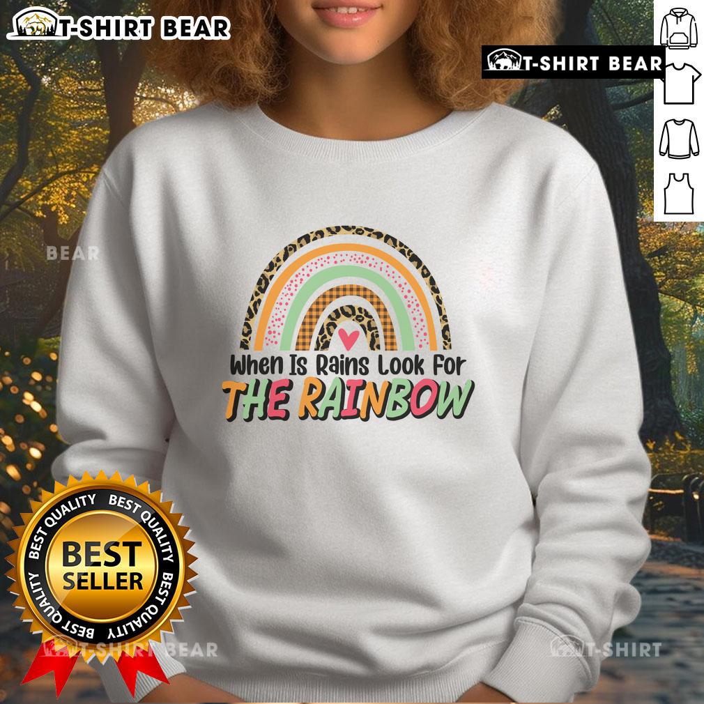 Cozy 'Pretty When It Rains, Look For The Rainbow' sweatshirt displayed on a model, perfect for rainy day fashion.