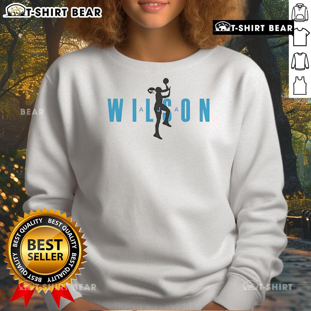 Aja Wilson statue featured on a stylish basketball sweatshirt, showcasing her impact in women's sports.