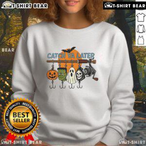 Alt Text: Top Catch Ya Later Halloween Horror Graphic Sweatshirt featuring spooky designs and vibrant colors, perfect for Halloween.