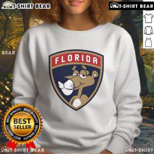 Alt Text: Stylish pink Florida Panthers logo sweatshirt featuring the team's emblem, perfect for fans and casual wear.