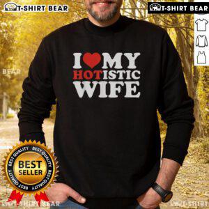 Top I Love My Hotistic Wife Sweatshirt displayed on a hanger, showcasing its stylish design and vibrant colors.