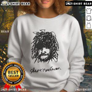 Alt Text: Top Shane MacGowan self-portrait sweatshirt featuring iconic artwork and vibrant colors, perfect for fans.