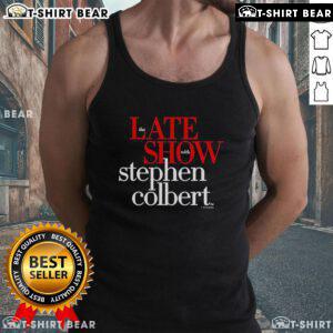 Stephen Colbert wearing a humorous tank top on The Late Show, showcasing his signature comedic style and personality.